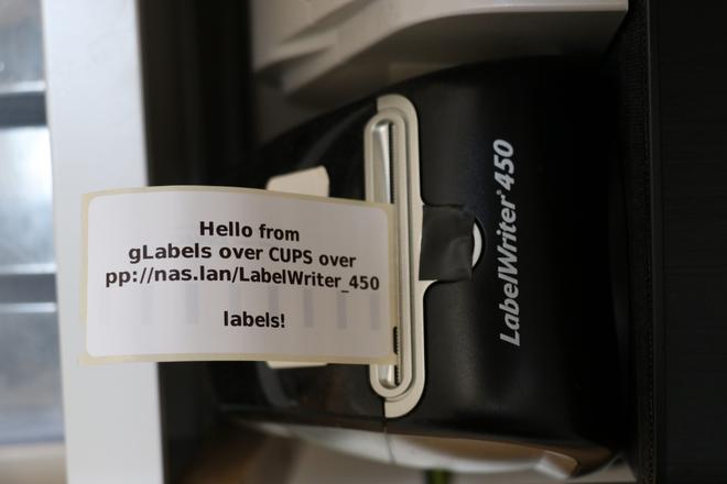 A photo of a label getting out of the printer with CUPS info.