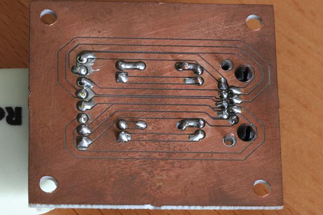 A photo of copper traces of the PCB on the bottom.