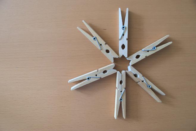 6 clothes pins disposed in a star shape